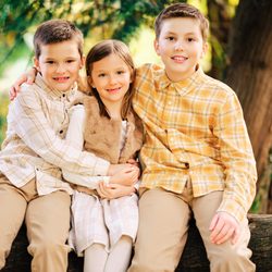 Katsanes Photography - Three children sitting on a large tree branch in Lake Oswego.