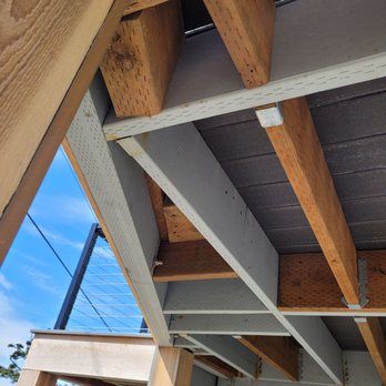 Mainline Carpentry & Construction - Oddly placed supports to strengthen the installation of the cable railing post and trex decking. - General Contractors Near Me