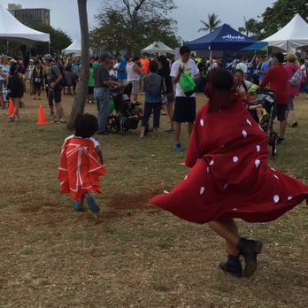 Jamba Banana Man 5K Chase - The strawberry and orange in action running the race. - Festivals Near Me - Honolulu, Hawaii