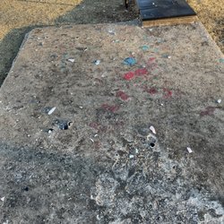 Westmoor - Glass on top of the storm shelter which is right outside the playground & pool area