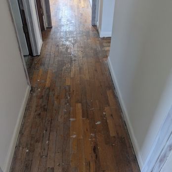 Fayton's Floors - Hallway before photo (in progress as staples and strips taken off) - Flooring Near Me