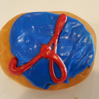 Dunkin' - a doughnut with blue icing and a pair of scissors - Donuts Near Me - Canton, Georgia Dunkin' - a doughnut with blue icing and a pair of scissors - Donuts Near Me - Canton, Georgia