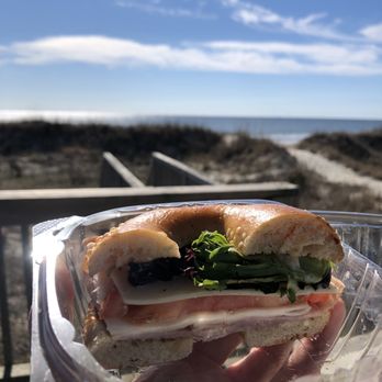Ruby's Coffeehouse & Eatery - a hand holding a sandwich - Coffee & Tea Near Me - Oak Island, North Carolina