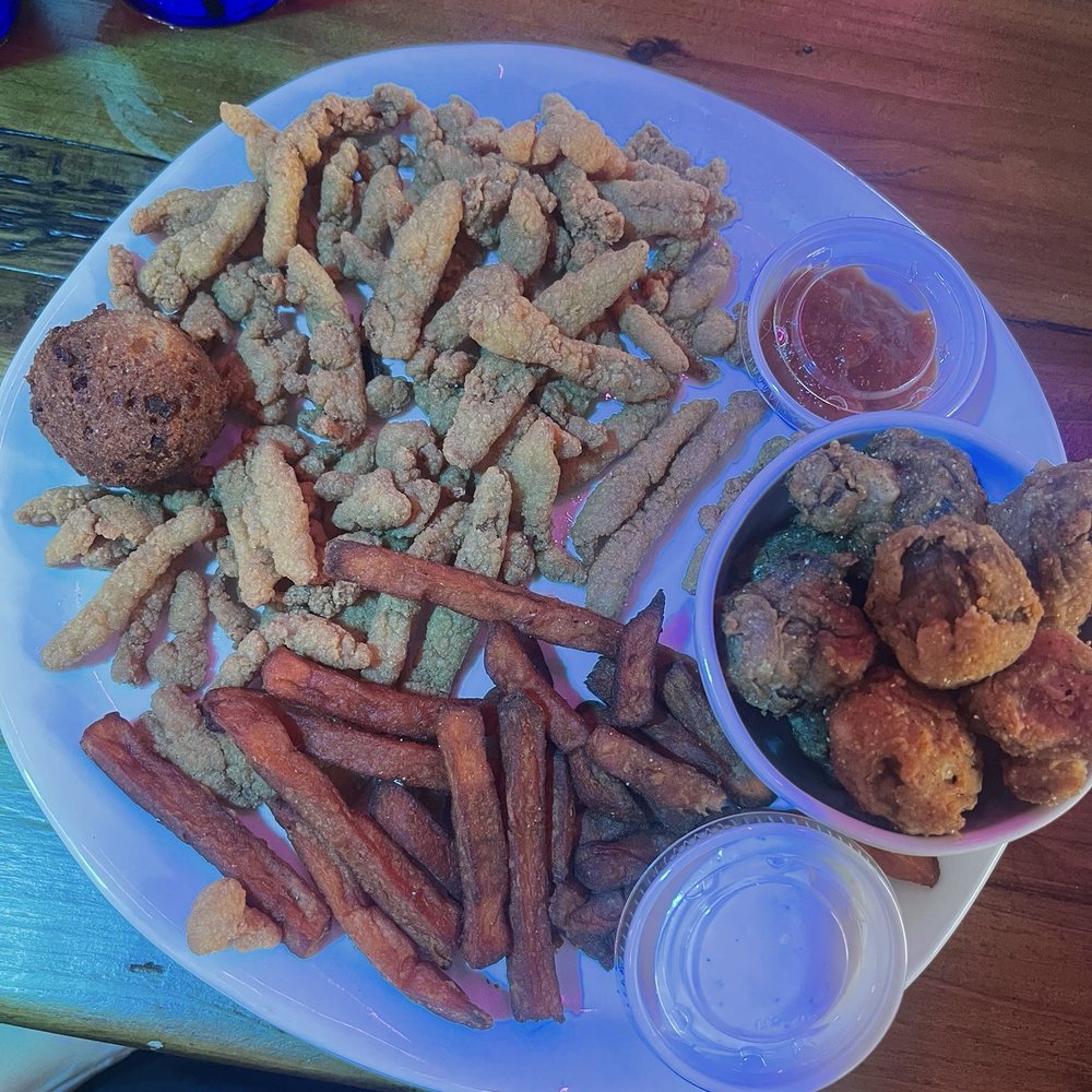 Cracklin' Jack's - Clam strip platter with hush puppy and bottles (fried mushrooms and sweet potato fries) - Seafood Near Me - Naples, Florida Cracklin' Jack's - Clam strip platter with hush puppy and bottles (fried mushrooms and sweet potato fries) - Seafood Near Me - Naples, Florida