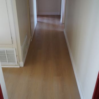 Jcl Flooring - Hallway with new Spc flooring vinyl planks and new baseboards - Flooring Near Me Jcl Flooring - Hallway with new Spc flooring vinyl planks and new baseboards - Flooring Near Me