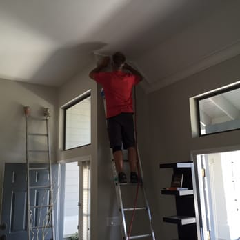 Decorative Mouldings - Mike working on our 15 foot ceilings - Carpenters Near Me