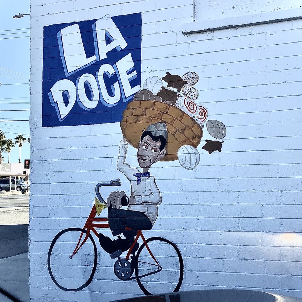 Super cute Cantinflas mural. La Doce = The 12th = the street this Estrella Bakery is located at.