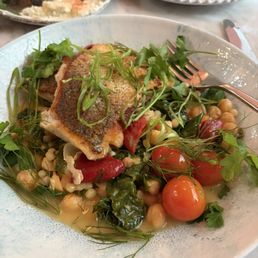 Striped sea base. Fish was flaky and cooked to perfection. Served with vegetables medley, heirloom tomatoes were delicious. Striped sea base. Fish was flaky and cooked to perfection. Served with vegetables medley, heirloom tomatoes were delicious.