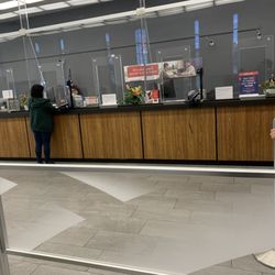 Bank of America Financial Center - One teller with 20 people waiting.. wasted my whole lunch hour at this location.. this place is terrible