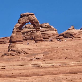 Arches National Park - The Delicate Arch from the upper view point. not as impressive from this vantage point, take the more difficult trail leading up to it - Parks Near Me Arches National Park - The Delicate Arch from the upper view point. not as impressive from this vantage point, take the more difficult trail leading up to it - Parks Near Me