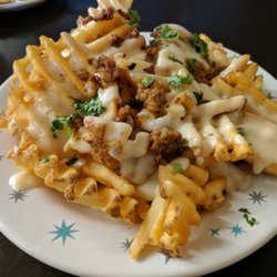 M66 Bar & Grill - Waffle Fries w/ Pepper Jack cheese sauce, chorizo, & cilantro