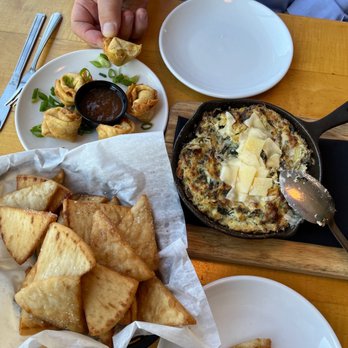Firefly Restaurant - Spinach artichoke dip with pita chips and crab Rangoon - Tapas/Small Plates Near Me - Traverse City, Michigan Firefly Restaurant - Spinach artichoke dip with pita chips and crab Rangoon - Tapas/Small Plates Near Me - Traverse City, Michigan