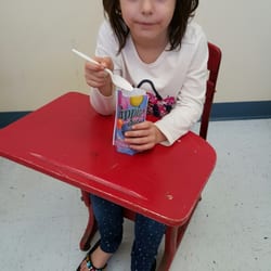 Rebecca enjoying an ice cream while awaiting a prescription.