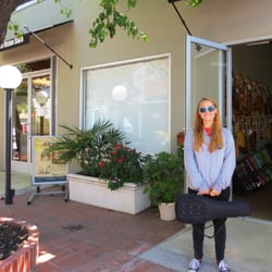 Anacapa Ukulele - My daughter outside the entrance (in a little courtyard - not right on Main) with her brand new concert ukulele.