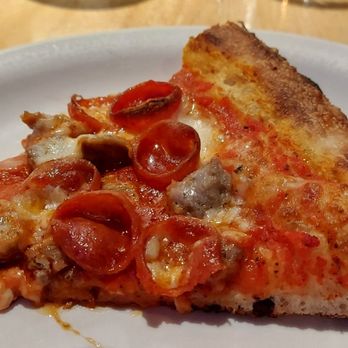 Robert's Pizza and Dough - Pizza slice close up - Pizza Near Me - Chicago, Illinois Robert's Pizza and Dough - Pizza slice close up - Pizza Near Me - Chicago, Illinois