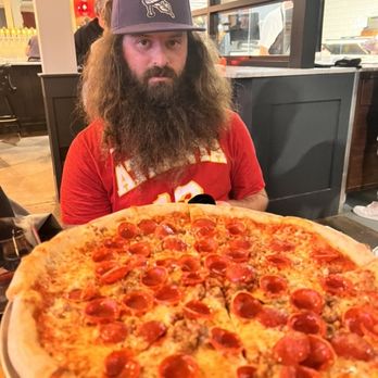 Red Wagon Pizza Company - Our son looking longingly at this amazing pizza - Pizza Near Me - Minneapolis, Minnesota