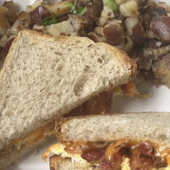 The Summit Cafe - Breakfast sandwich with chipotle sauce and hash brown potatoes - Breakfast & Brunch Near Me - Canmore, Alberta The Summit Cafe - Breakfast sandwich with chipotle sauce and hash brown potatoes - Breakfast & Brunch Near Me - Canmore, Alberta