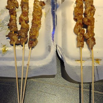 Xinjiang BBQ - Lamb Kababs (non-spicy on the left tray, mild spiciness on the right tray) - Asian Fusion Near Me - San Diego, California Xinjiang BBQ - Lamb Kababs (non-spicy on the left tray, mild spiciness on the right tray) - Asian Fusion Near Me - San Diego, California