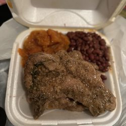 The Good Life Cafe - Smothered pork chop with red beans and rice plus yams. So good!