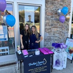 Skye and Lexi greeting clients as they walk by in  Watters Creek Village, Allen TX