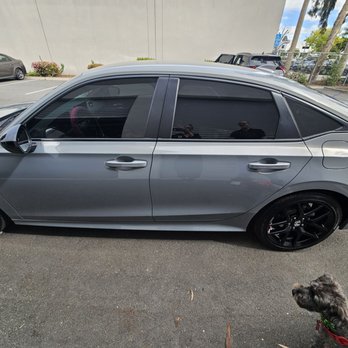 Sun Busters - Onyx admiring the tint job done by Jim! - Car Window Tinting Near Me - Tustin, California
