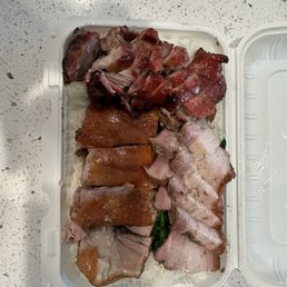 Triple rice plate with BBQ Pork 蜜汁叉燒, Crispy Roasted Pork 脆皮燒肉, and roasted duck. Triple rice plate with BBQ Pork 蜜汁叉燒, Crispy Roasted Pork 脆皮燒肉, and roasted duck.