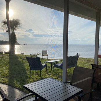 Lillo's Tuscan Grille - Outdoor seating is screened in. It was still warm so we ate inside but still had views of the water. - Italian Near Me - Gulf Breeze, Florida