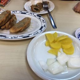 Dumplings and banchan. The dumplings were ok; we really got them for the kid. Dumplings and banchan. The dumplings were ok; we really got them for the kid.