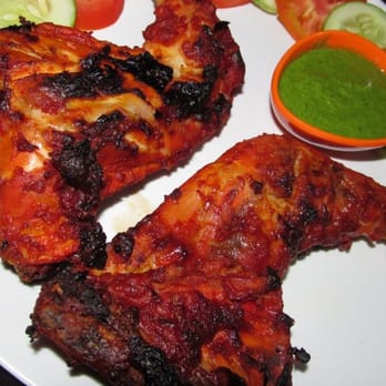 India Food Kitchen - a plate of chicken wings and vegetables - Food Delivery Services Near Me
