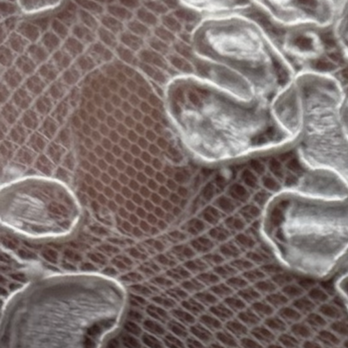 Nino Tailoring & Alterations - hole in the back of the dress patched with mismatched mesh - Sewing & Alterations Near Me - Anaheim, California