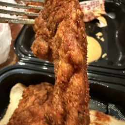 Skimpy chicken sitting under heat lamps.  Single Tender