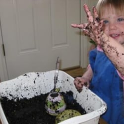 Sunrise Montessori Preschool - Learning how dirt feels and how to re-pot a plant
