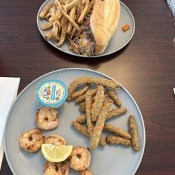 Philly cheesesteak and grilled shrimp.