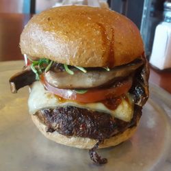 Burger Me! - Dry-Aged Portabella Burger - 1/2 lb 30-day dry aged Wagyu/Brisket blend w/Swiss, Portabella, Arugula, tomato, & balsamic glaze drizzle.