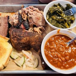 Sampler Platter: 3 meats (pulled pork, chicken, and brisket), greens, baked beans, and Texas toast. Sampler Platter: 3 meats (pulled pork, chicken, and brisket), greens, baked beans, and Texas toast.