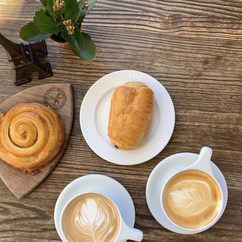 Le Coffee Shop - Chocolate croissant, orange pastry, and a moccachino & rose vanilla latte - Breakfast & Brunch Near Me - Temecula, California Le Coffee Shop - Chocolate croissant, orange pastry, and a moccachino & rose vanilla latte - Breakfast & Brunch Near Me - Temecula, California