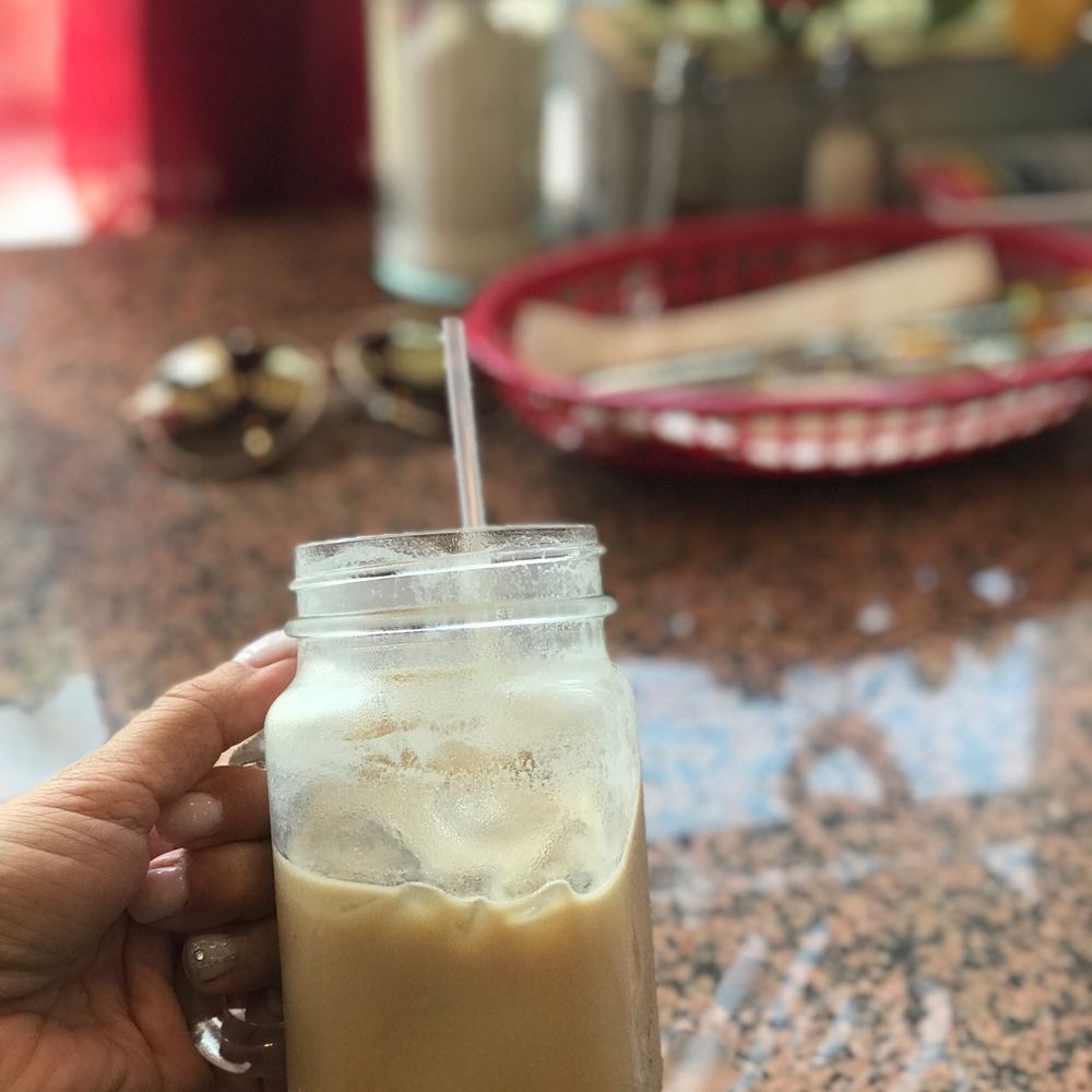Nuestra Pasion Coffee Shop - a hand holding a cup of coffee - Coffee & Tea Near Me - Butler, New Jersey Nuestra Pasion Coffee Shop - a hand holding a cup of coffee - Coffee & Tea Near Me - Butler, New Jersey