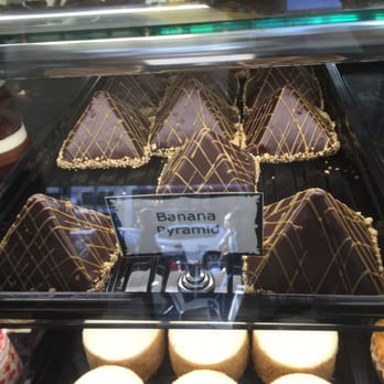 Mi Piace - Deserts on display in the front counter entry area. Banana Pyramid. - Italian Near Me - Pasadena, California Mi Piace - Deserts on display in the front counter entry area. Banana Pyramid. - Italian Near Me - Pasadena, California