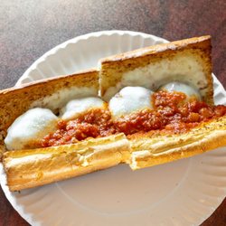 Broadway Pizza and Grill - Our juicy and cheese homemade meatball parmesan sandwich!  Only a napkin is needed after enjoying this sandwich!!!