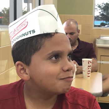 Krispy Kreme - My son enjoying his freshly made donut. - Donuts Near Me - Kissimmee, Florida Krispy Kreme - My son enjoying his freshly made donut. - Donuts Near Me - Kissimmee, Florida