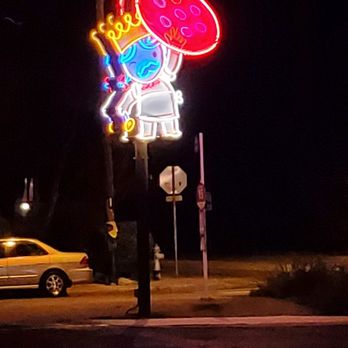 Home Slice Pizza - Look for this neon sign. It is the neon glow of YUM - Pizza Near Me - Austin, Texas