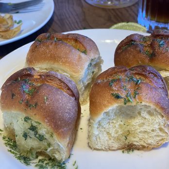 Moby Dick Restaurant - Parker rolls dropping in garlic butter yum - American Near Me - Santa Barbara, California