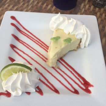 Hobo's Cafe - Key lime pie with tiny candy feet. Not a baked custard, but KLP is likely to be somewhat abused in a tourist center like southern Fla. - New American Near Me - Key Largo, Florida Hobo's Cafe - Key lime pie with tiny candy feet. Not a baked custard, but KLP is likely to be somewhat abused in a tourist center like southern Fla. - New American Near Me - Key Largo, Florida