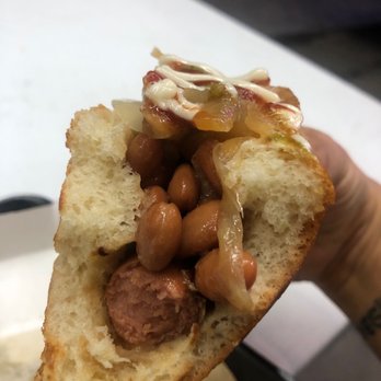 Baja Fish Tacos - a hand holding a piece of bread - Hot Dogs Near Me - Phoenix, Arizona Baja Fish Tacos - a hand holding a piece of bread - Hot Dogs Near Me - Phoenix, Arizona