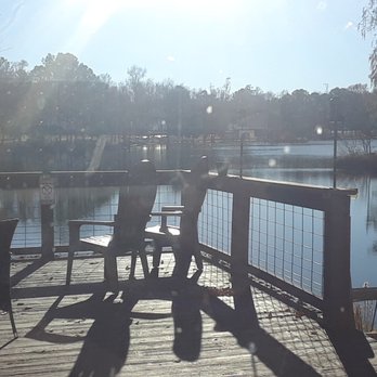 The Beer Barn - two people on a deck overlooking a lake - Breweries Near Me - Kinston, North Carolina The Beer Barn - two people on a deck overlooking a lake - Breweries Near Me - Kinston, North Carolina