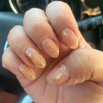 Enchanted Nails & Spa - March 2022: Translucent nude dip powder manicure with gold gel shark/Pisces inspired designs - Nail Salons Near Me - Washington, DC, District of Columbia