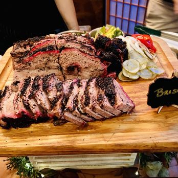 Smoke & Barrel - a wooden cutting board with meat on it - Bars Near Me - Queens, New York
