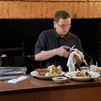 Antiquity Restaurant - Preparing the king crab for easy eating - Seafood Near Me - Albuquerque, New Mexico