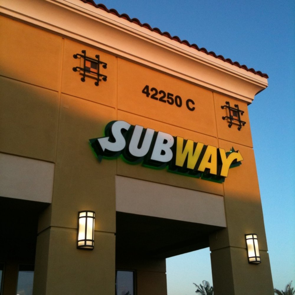 the entrance to a subway restaurant the entrance to a subway restaurant