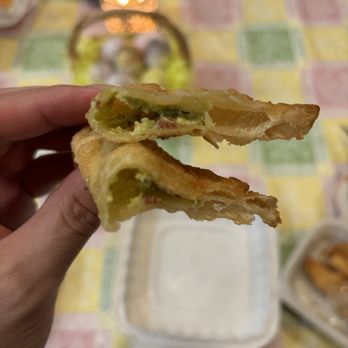 The Craft House - a person holding a half eaten sandwich - Gastropubs Near Me - Clovis, California The Craft House - a person holding a half eaten sandwich - Gastropubs Near Me - Clovis, California